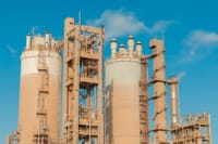 A view of urea towers at an industrial plant in Libya, captured on a clear day.