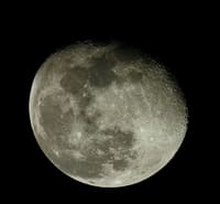Detailed image of the moon showing craters and surface texture.