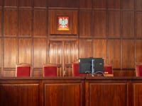 A beautifully crafted wooden courtroom with the Polish emblem in Wrocław, Poland.