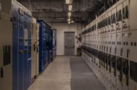 A sophisticated control room filled with electrical panels and equipment for industrial purposes.