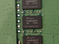 Detailed view of SK hynix DRAM chips on a green circuit board featuring electronic components.