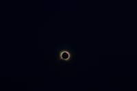 Captivating view of a total solar eclipse with a glowing corona set against a deep dark sky.