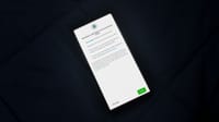 Close-up of smartphone screen showing a privacy policy update agreement.