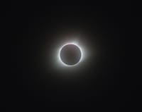 A breathtaking view of a full solar eclipse, showcasing the sun's corona.