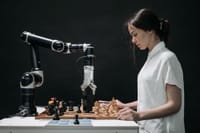 A robot and woman engage in chess, showcasing technology and strategic thinking.