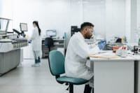 Researchers analyzing samples in a modern laboratory equipped with advanced technology.