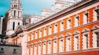 Facade of Old Admiralty Building in London with clear blue sky and classic architecture.
