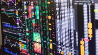 Detailed financial trading screen with colorful charts and data representing market fluctuations.