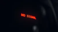 A red LED display indicating 'No Signal' in a dark setting, conveying a tech warning.