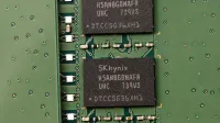 Detailed view of SK hynix DRAM chips on a green circuit board featuring electronic components.