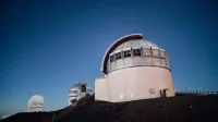 A stunning observatory under a clear, starry night sky, perfect for astronomy enthusiasts.
