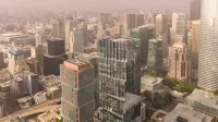 Stunning aerial view of San Francisco's modern skyline showcasing prominent skyscrapers on a foggy day.