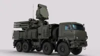 Detailed image of a military vehicle equipped with advanced radar and weaponry systems.
