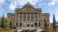 Front view of Luzerne County Courthouse, Wilkes-Barre, under a blue sky.