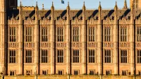 Close-up view of Westminster Palace's intricate Gothic architecture in London, UK.