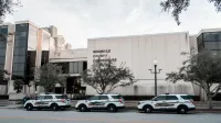 Sheriff vehicles parked in front of Seminole County Courthouse during the day.