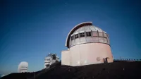 A stunning observatory under a clear, starry night sky, perfect for astronomy enthusiasts.