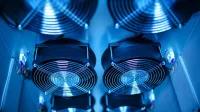 Close-up of cooling fans in a server room, showcasing technology and efficiency.