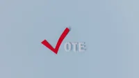 Red check mark with the word "VOTE" on a blue background, symbolizing election participation.