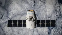 SpaceX Dragon spacecraft in orbit, highlighting advanced space technology with cloud backdrop.