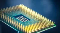 High-resolution macro shot of a computer CPU chip with gold pins against a blue background.