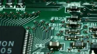 Detailed macro view of a circuit board showcasing microchips and electronic components.