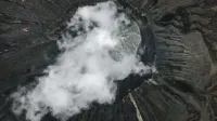 Aerial view of scenery with powerful rough soaring volcanic crater located in mountainous area