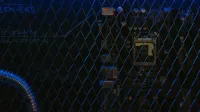 Artistic view of a circuit board through metal mesh with blue lighting.