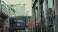 Exterior view of European Parliament with EU flags in Brussels