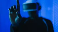 Close-up of a person in a VR headset interacting, showcasing a modern technology setup.