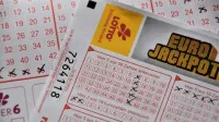 Detailed close-up of a EuroJackpot lottery ticket with selected numbers in focus.