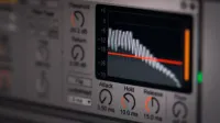 Close-up of audio editing software interface featuring waveform and controls.