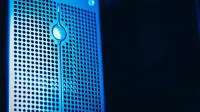 Modern server rack with blue lighting in a secure data center environment.