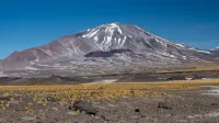 Stunning Andean mountain with snow caps under a clear blue sky.