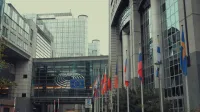 Exterior view of European Parliament with EU flags in Brussels