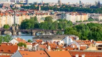 Explore the historic charm of Prague's bridges and architecture with this stunning aerial cityscape.