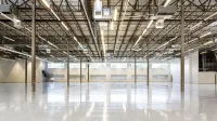 Empty industrial warehouse interior with polished concrete floor in Houston, Texas.