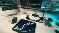 A modern trading desk with screens displaying financial charts and graphs, showcasing a digital analysis setup.