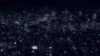 A stunning view of Tokyo's cityscape with illuminated skyscrapers at night, showcasing urban life in Japan.