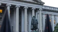Statue of Albert Gallatin in front of the US Treasury Department building in Washington, DC.