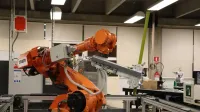 Industrial robotic arm in a Ciudad de México lab setting, showcasing automation technology.