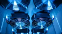 Close-up of cooling fans in a server room, showcasing technology and efficiency.