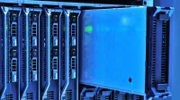 Detailed view of server racks with glowing lights in a data center environment.