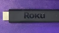 A Roku streaming stick device.