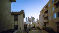 View of downtown skyscrapers from residential area, perfect for urban lifestyle themes.