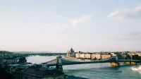 A picturesque view of Budapest featuring the Chain Bridge and Hungarian Parliament along the Danube River.