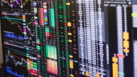 Detailed financial trading screen with colorful charts and data representing market fluctuations.
