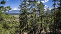 This 2.4 mile moderately easy hiking trail rises from 7,362 feet to 8,215 feet in elevation to the top of Slate Mountain.