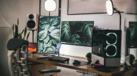 Stylish gaming and streaming setup with dual monitors, PC, and accessories.
