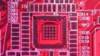 Top view of colorful printed board with bright electric circuits of modern technical machine with various figures and letters on surface